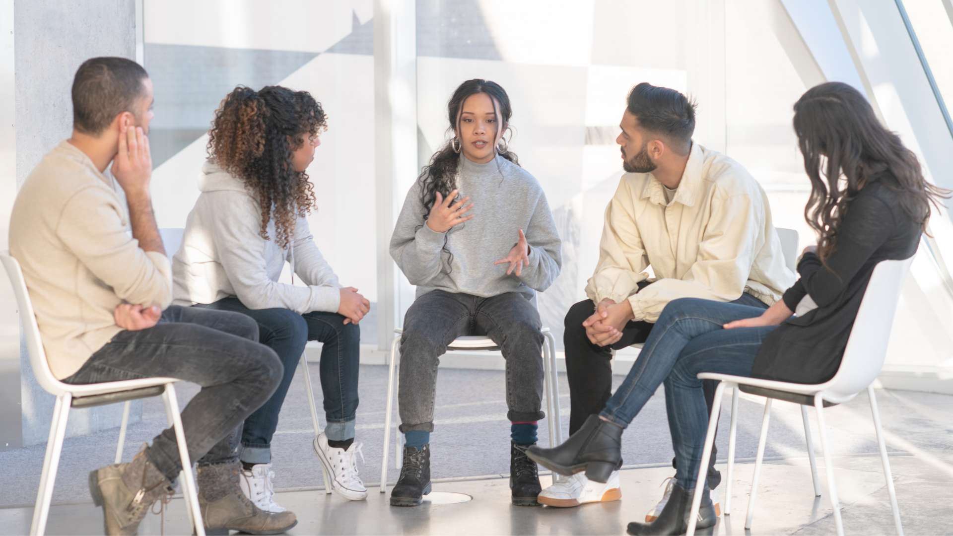 A psychiatric provider reviewing a patient's treatment history during a consultation